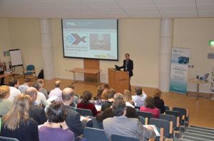 Scientists listening to a talk by Manuel Barange inside the lecture theatre at Plymouth Marine Laboratory